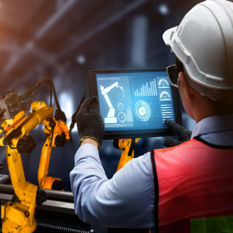 Manufacturing worker holding tablet with robot analytics displayed